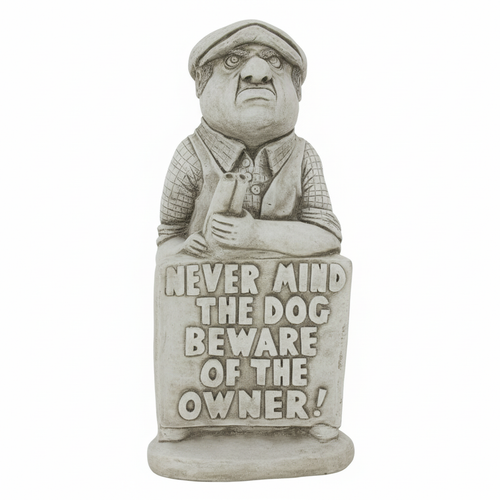 Close-up of humorous statue face and cap details